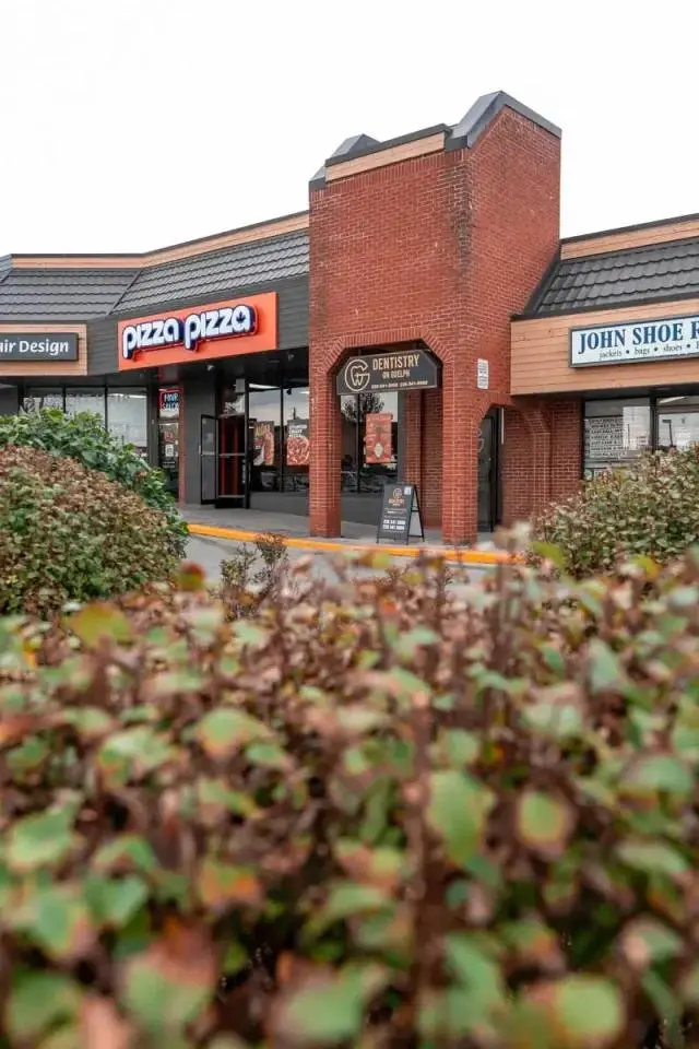 Exterior view of Dentistry on Guelph, a modern dental clinic located in a shopping plaza, Guelph.